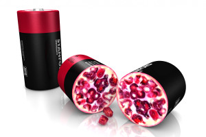 Künstlerisch illustriert, sitzen umhüllte Silizium-Nanopartikel in der Batterie wie Granatapfelkerne in der Frucht