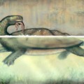 Eine Riesenschildkröte der Art Carbonemys verzehrt ein kleines Crocodylomorph (künstlerische Darstellung).